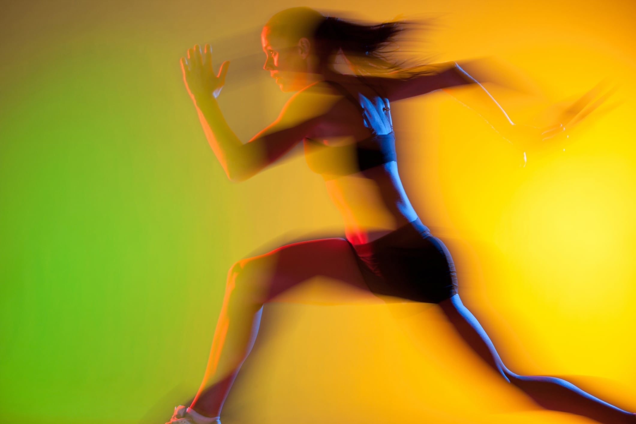 Blurred view of female athlete running