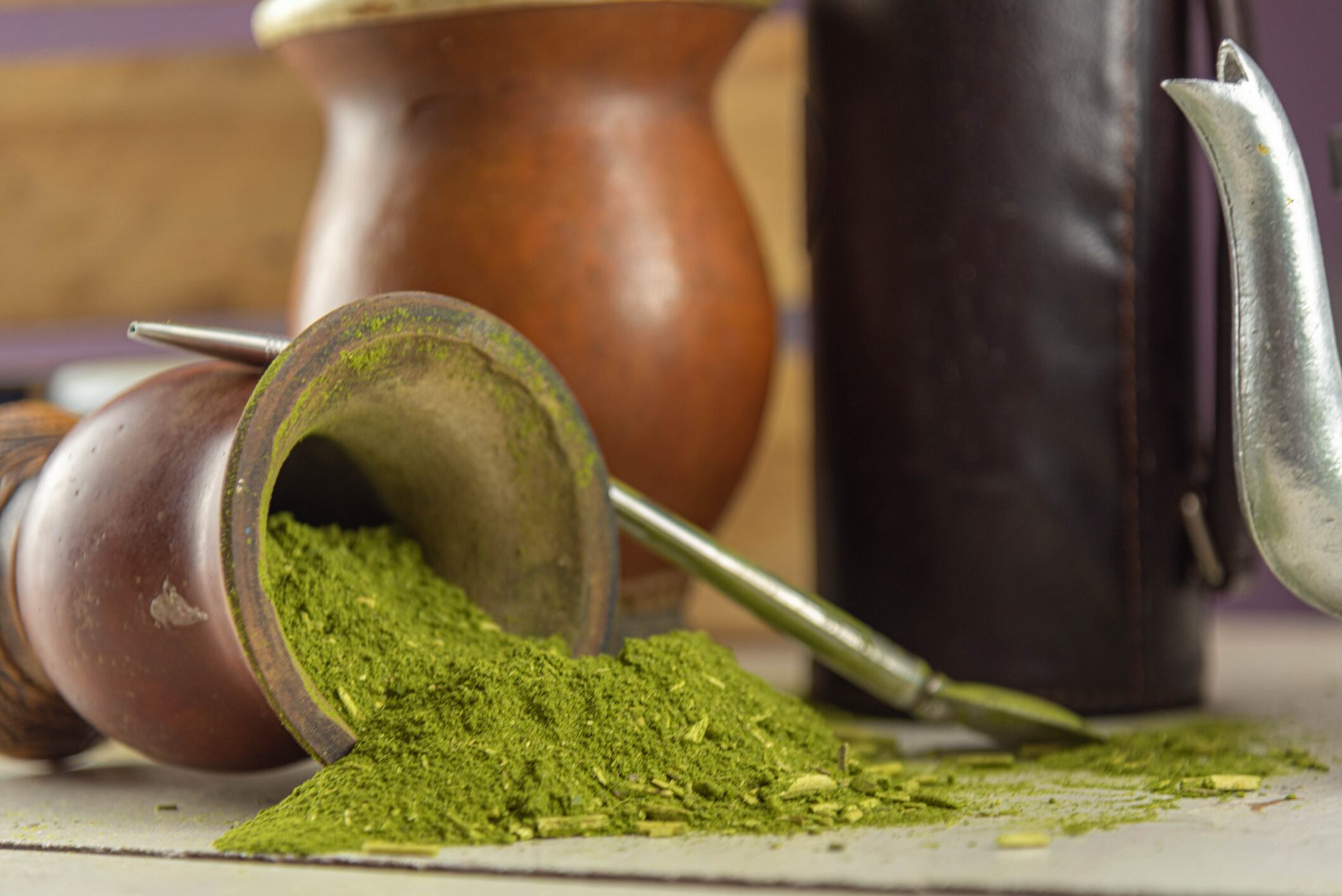Mate herb (Ilex paraguariensis) and utensils for preparing mate tea. Yerba mate also called congonha, is a tree of the aquifoliaceous family, originating from the subtropical region of South America.