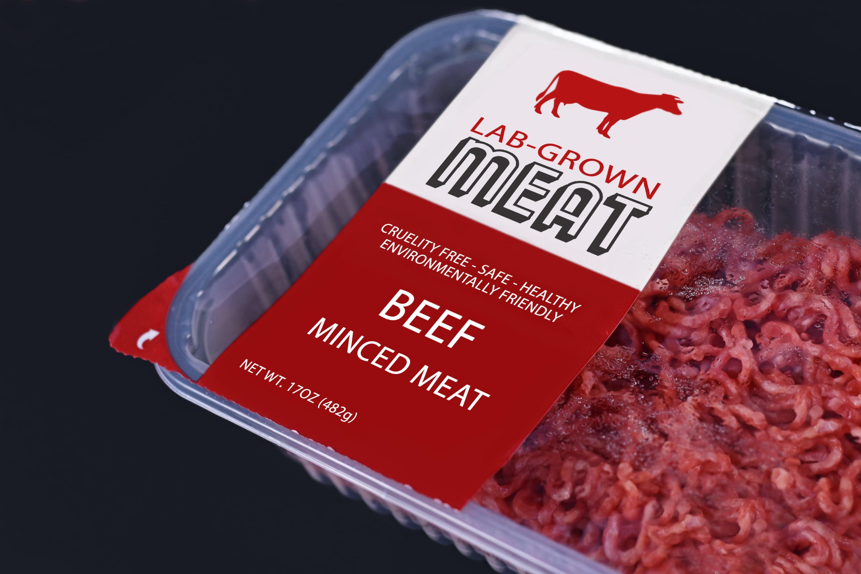 Lab grown cultured meat concept for artificial in vitro cell culture meat production with packed raw minced beef meat with made up label on dark background