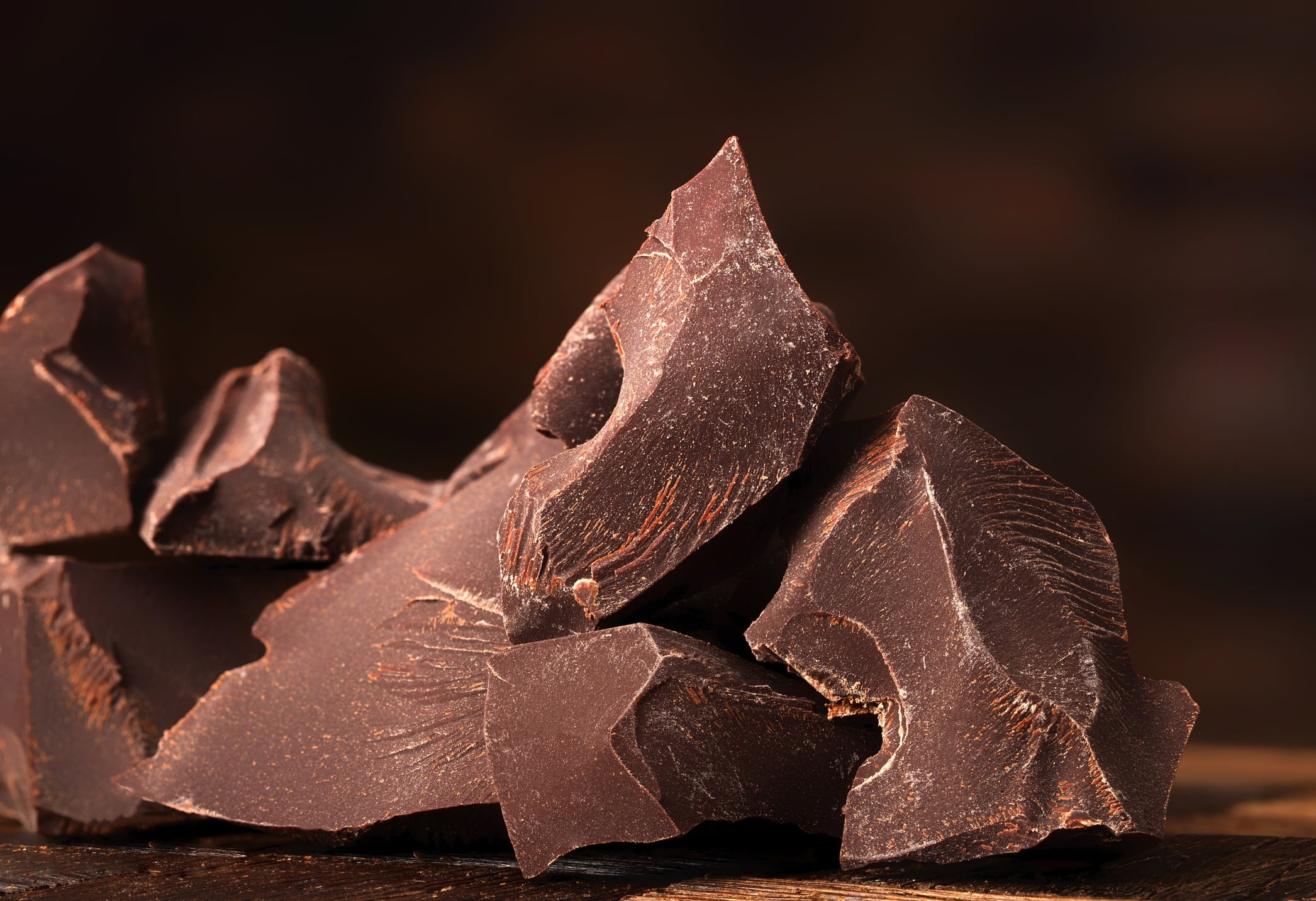Rough-cut pieces of dark chocolate.
