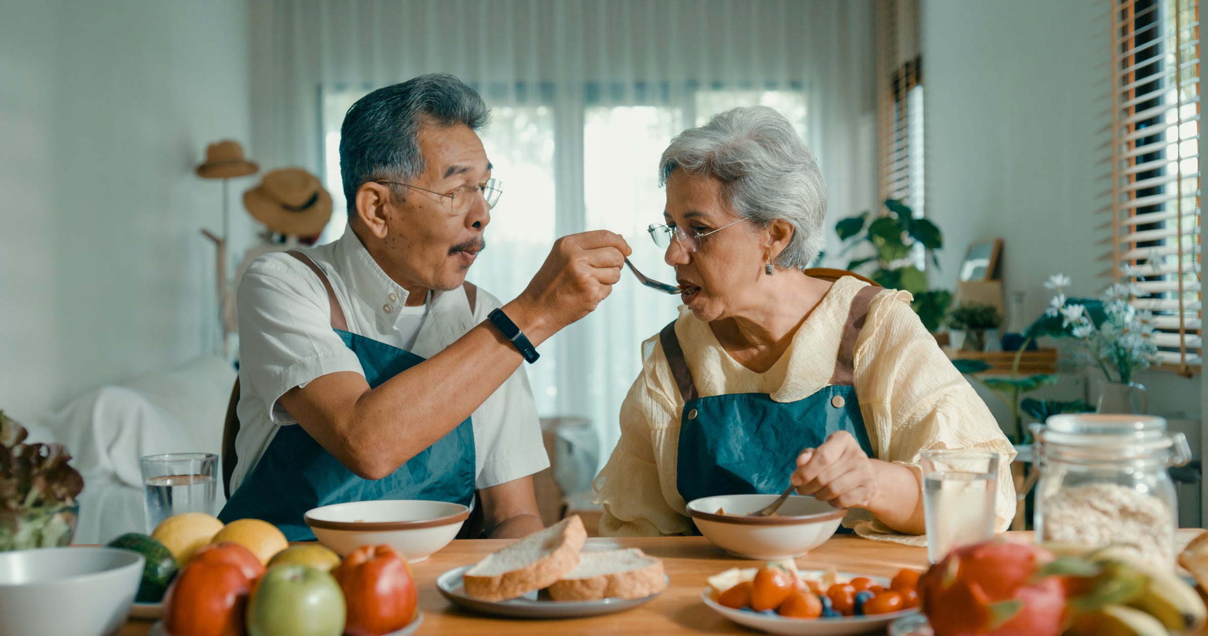 Elderly Asian couple enjoying healthy meal