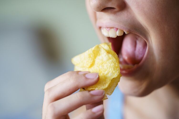 Girl eating potato chips