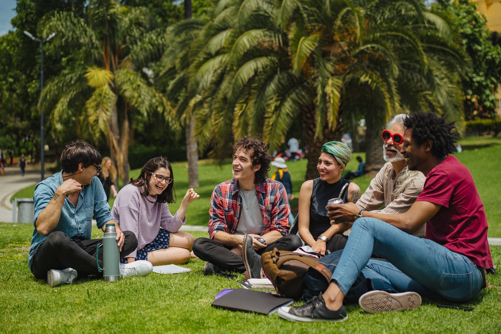 A group of young people consuming yerba mate.