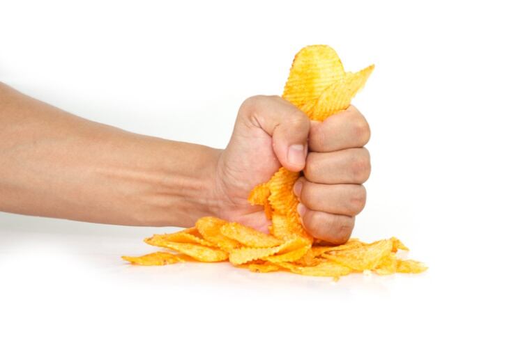 Fist bashing potato chips