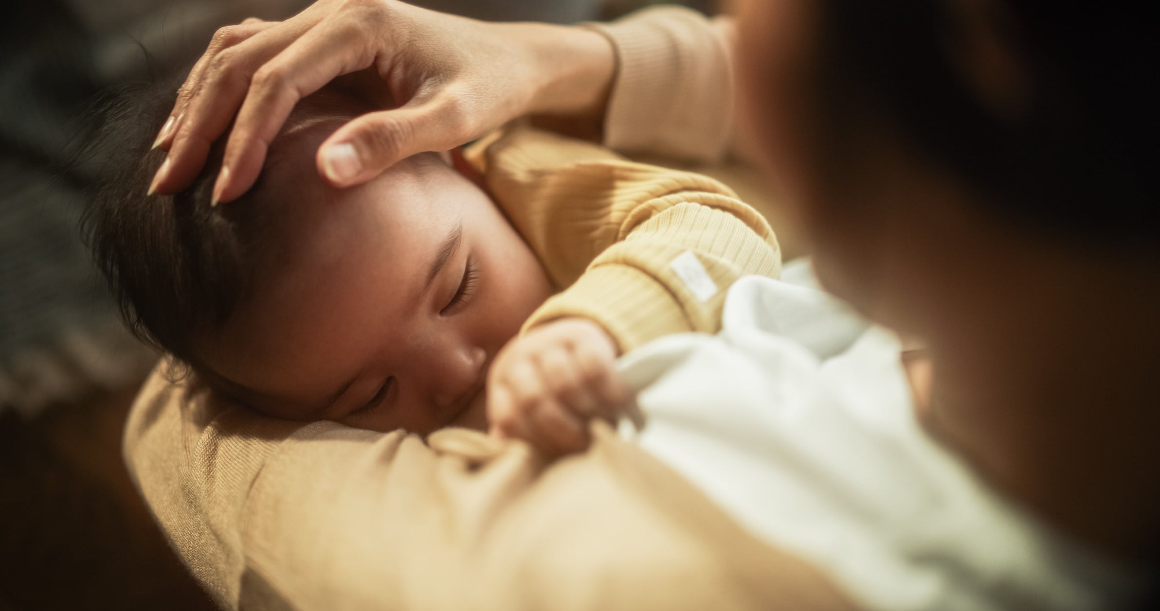 Cute Asian baby breastfeeding