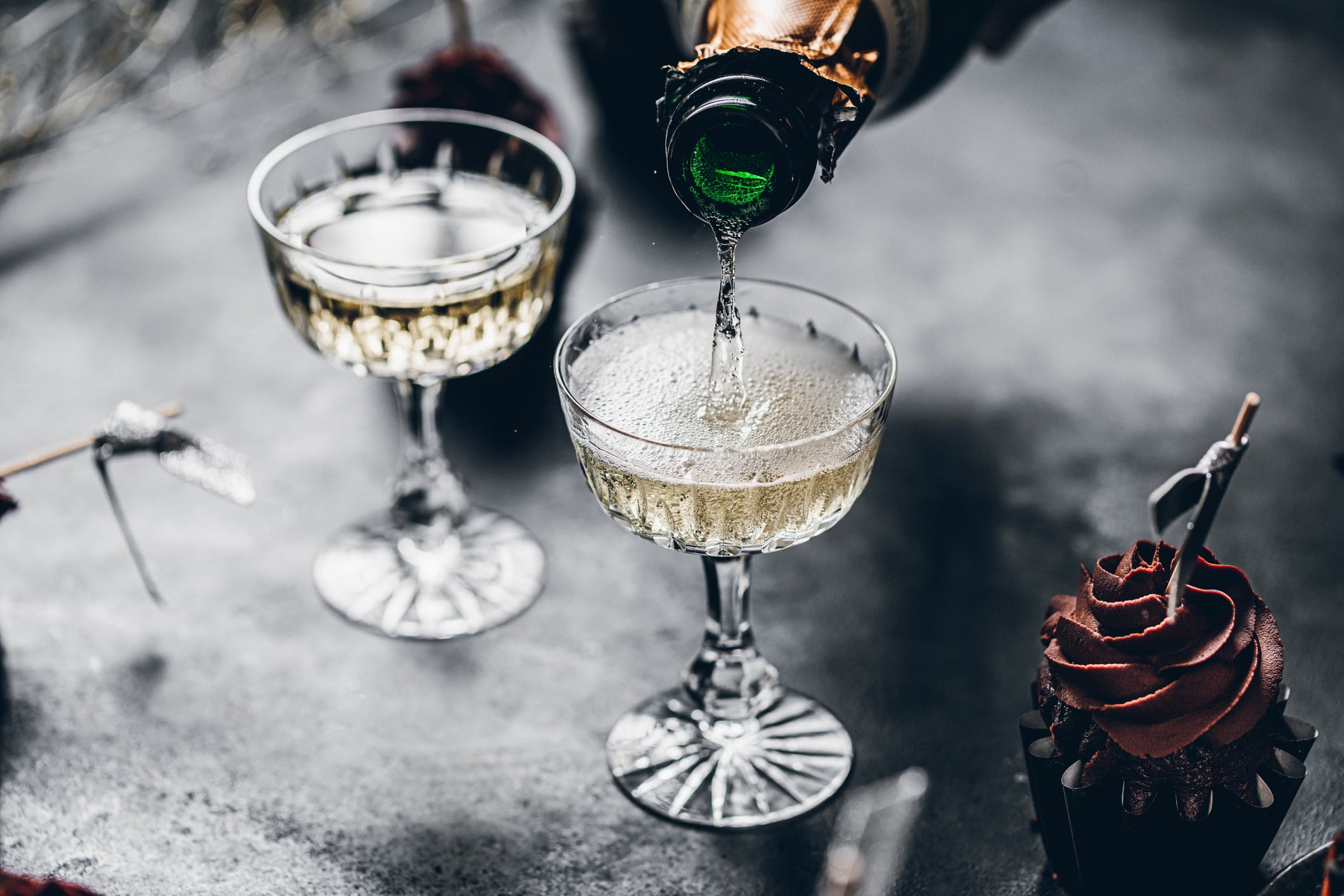 Pouring alcohol into glasses