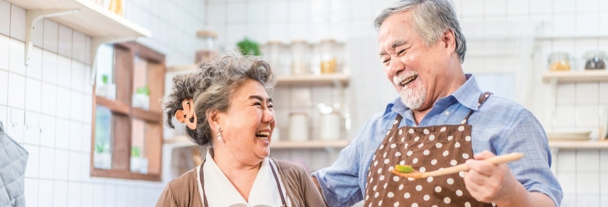 Older couple cooking together