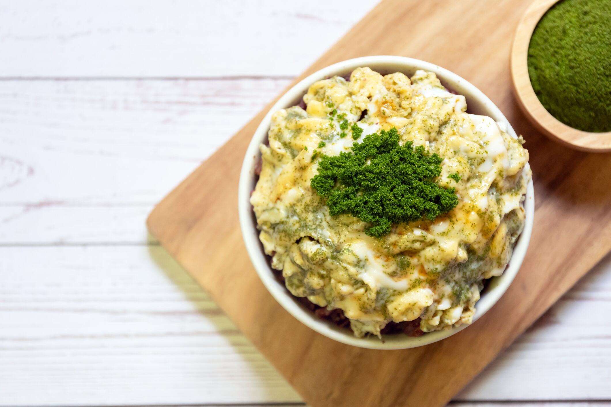 Creamy omelette with wolffia globosa on rice.