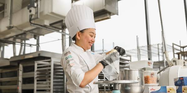 Female chef decorating