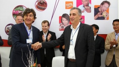 Local heads of the two companies celebrate the agreement
