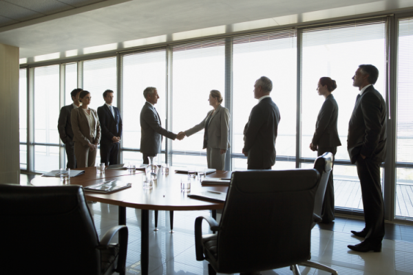 GettyImages Robert Daly - corporate boardroom business deal
