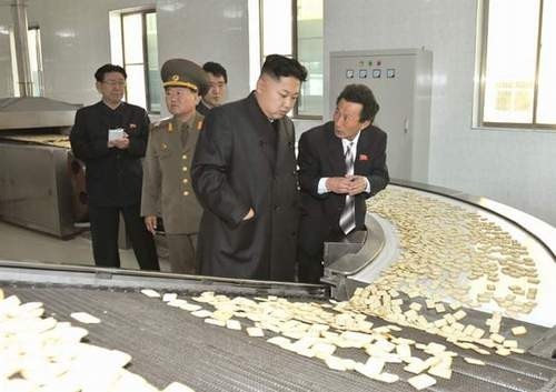Kim Jong Un inspecting cracker production line in North Korea.