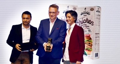 Jack Plew, centre, collects the Gulfood Innovation Award. 