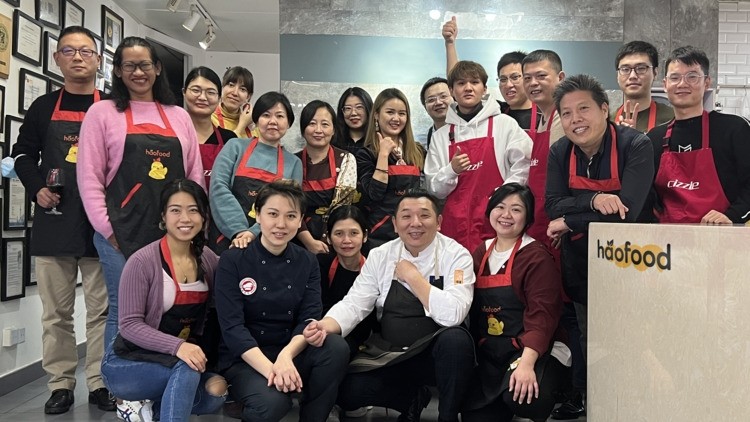 CEO of Haofood Astrid Prajogo (standing, second from left) with her team. © Haofood